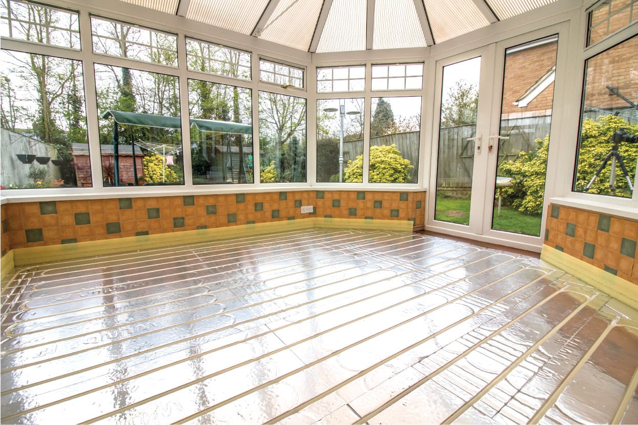 A conservatory that has pre channelled UFH boards laid ready for pipes